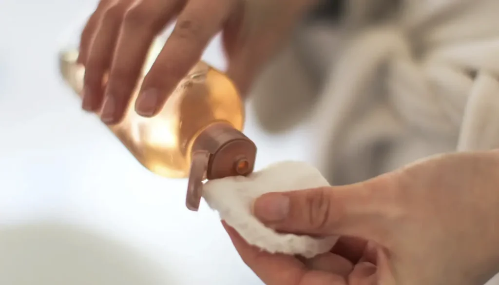 Pouring liquid onto a cotton pad from a small bottle - Daily Toner Side Effects: Safe or Harmful Use? 2026 - Zicail Pouring liquid onto a cotton pad from a small bottle - Daily Toner Side Effects: Safe or Harmful Use? 2026 - Zicail
