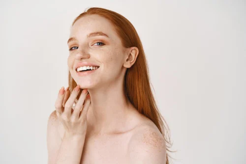 Smiling woman showing healthy skin after exosome therapy for skin radiance - Witch Hazel: Benefits, Uses & Side Effects for Healthy Skin 2026 - Zicail