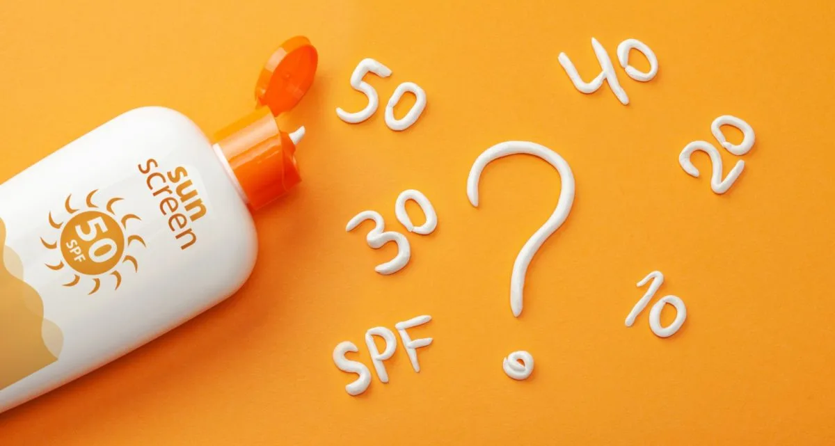 Sunscreen bottle with various SPF values and a question mark