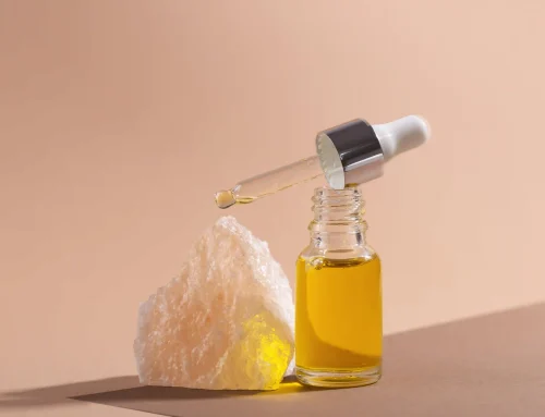 Essence bottle with a rock on a neutral background - Toner vs Essence: Differences & Which One You Need - Zicail Essence bottle with a rock on a neutral background - Toner vs Essence: Differences & Which One You Need - Zicail