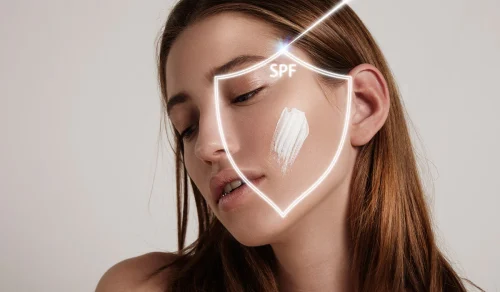 Womans face with sunscreen and an SPF shield graphic overlay - Does High SPF Sunscreen Protect You Better? 2026 - Zicail