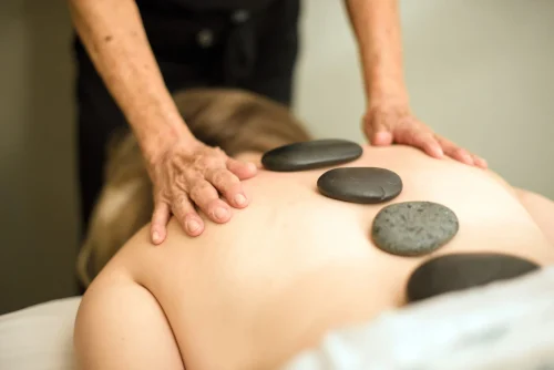 Hot stone massage on a persons back during a session - Natural Skincare Routine: Simple Steps for Healthy Skin [October 2026] - Zicail