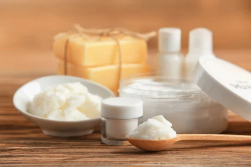 Shea butter skincare containers and soaps on a wooden surface - Natural Skincare Routine: Simple Steps for Healthy Skin [October 2026] - Zicail