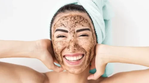 Woman smiling with an exfoliating scrub on her face - Natural Skincare Routine: Simple Steps for Healthy Skin [October 2026] - Zicail