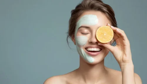 Woman with a face mask holding a lemon slice to her eye - Natural Skincare Routine: Simple Steps for Healthy Skin [October 2026] - Zicail