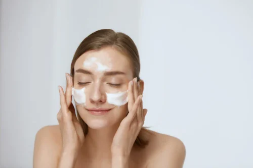 Woman with face cleanser foam on her face - Skincare Routine for Dry Skin: How to Start Without Overdoing It 2026 - Zicail Woman with face cleanser foam on her face - Skincare Routine for Dry Skin: How to Start Without Overdoing It 2026 - Zicail