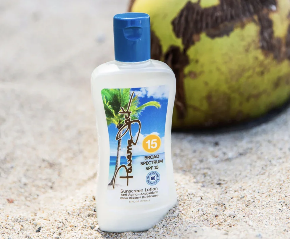 SPF 15 sunscreen bottle on sandy beach with tropical background - What Is a Natural Sunscreen? Full Guide + Tips 2026 - Zicail SPF 15 sunscreen bottle on sandy beach with tropical background - What Is a Natural Sunscreen? Full Guide + Tips 2026 - Zicail