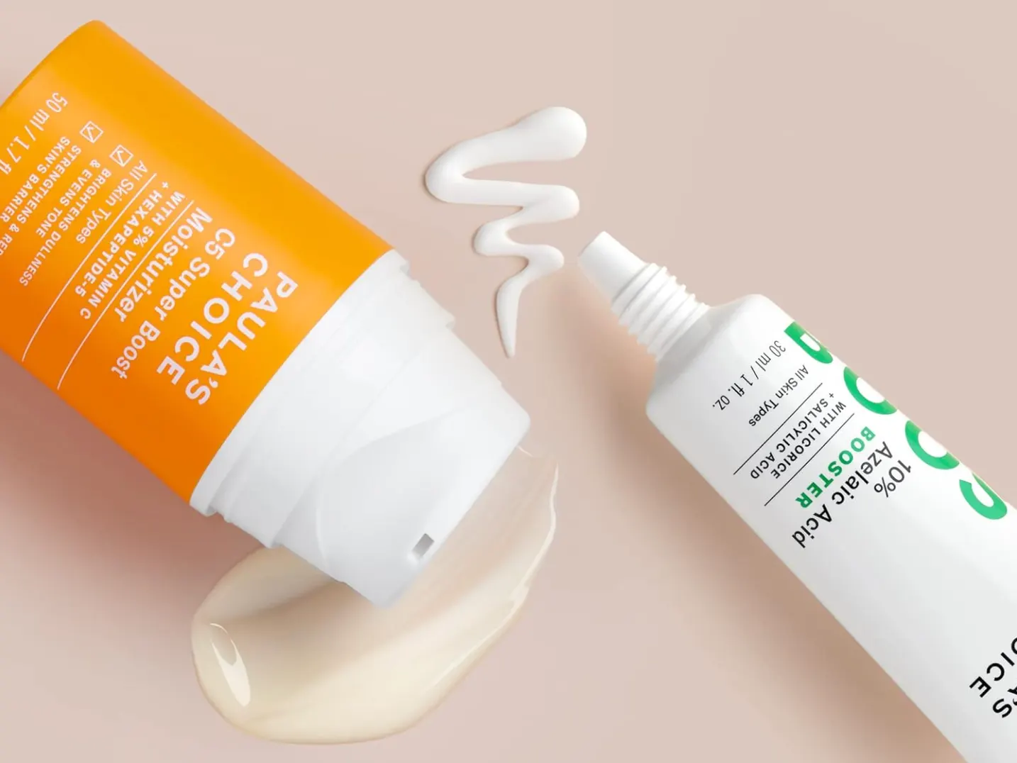 Orange and white skincare tubes on beige - Azelaic Acid vs Vitamin C: Benefits & Use Guide 2026 - Zicail