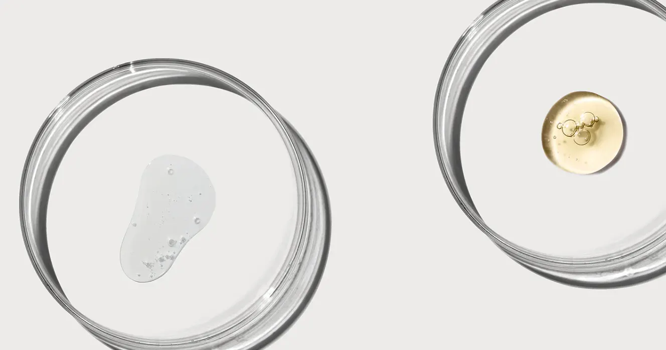Two clear liquids in separate petri dishes - Azelaic Acid vs Vitamin C: Benefits & Use Guide 2026 - Zicail