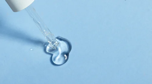 Bottles of serums perhaps containing lactic or hyaluronic acid - How to Layer Hyaluronic Acid and Lactic Acid 2026 - Zicail