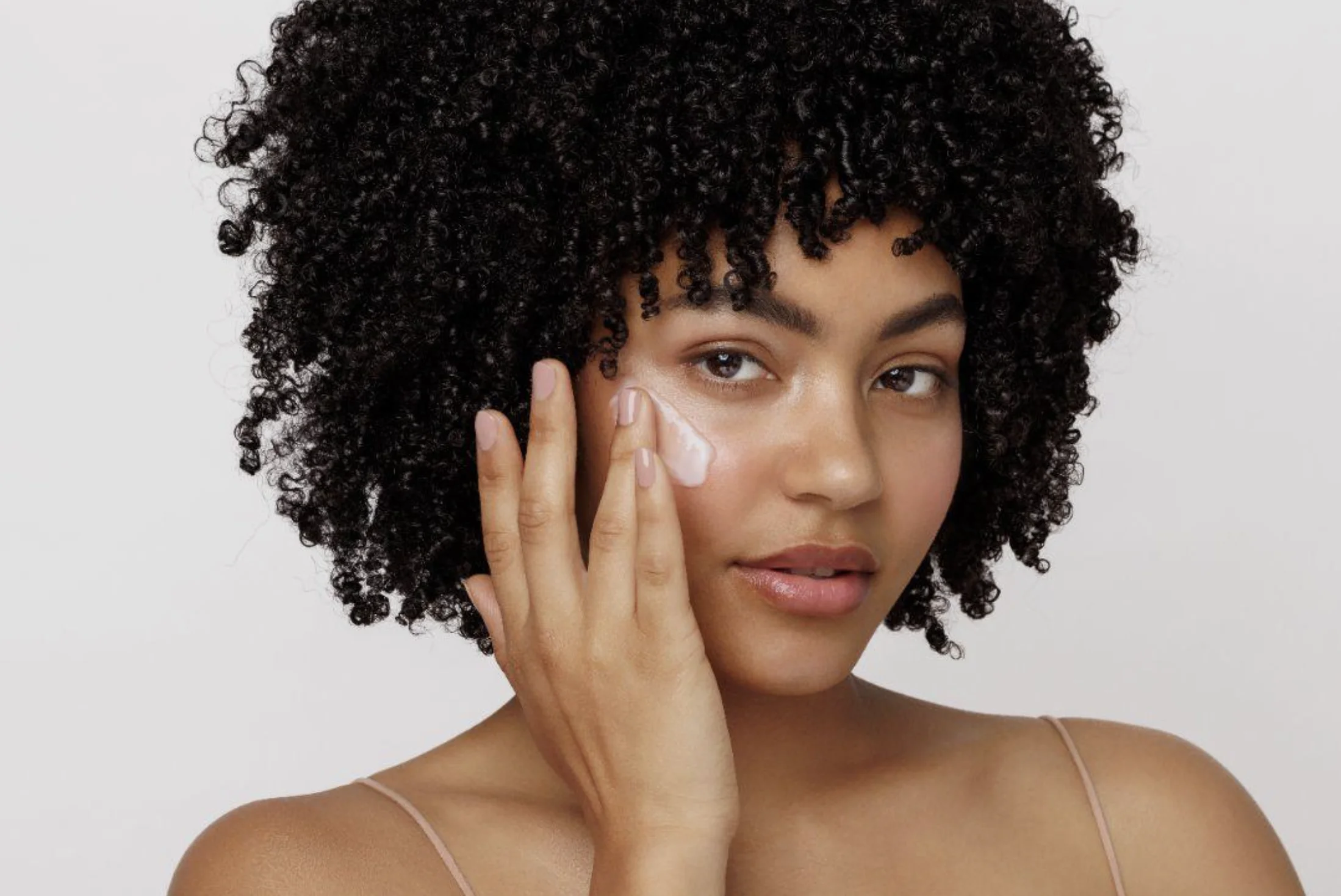 Applying Coenzyme Q10 cream to skin - Coenzyme Q10 in Skincare: Benefits & How to Use 2026 - Zicail