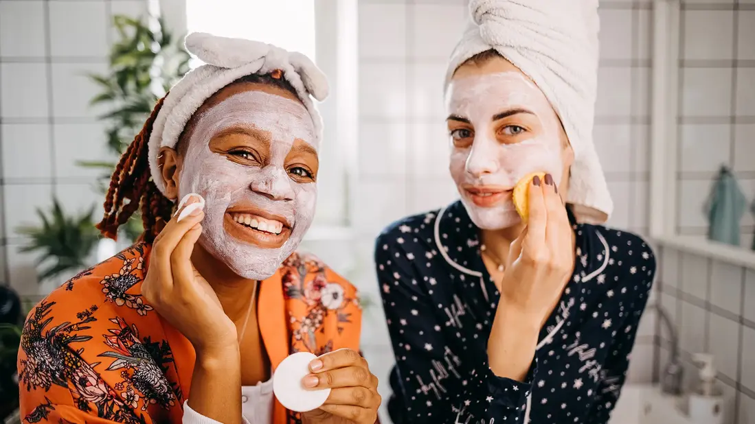 Two women wearing face masks with Allantoin benefits - Allantoin in Skincare: Benefits & How to Use It 2026 - Zicail Two women wearing face masks with Allantoin benefits - Allantoin in Skincare: Benefits & How to Use It 2026 - Zicail
