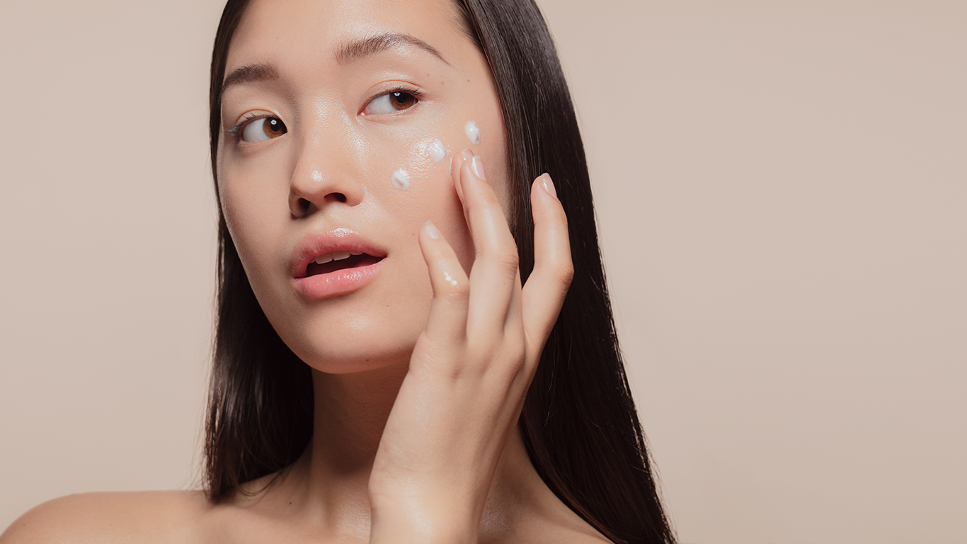 Flat lay of Korean skincare essentials on beige - Are Korean Skincare Products Better for Asians? 2026 - Zicail