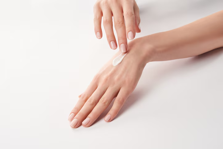 Hand applying cream with cucumber extract - Cucumber Extract in Skincare: Top Benefits & Uses 2026 - Zicail Hand applying cream with cucumber extract - Cucumber Extract in Skincare: Top Benefits & Uses 2026 - Zicail