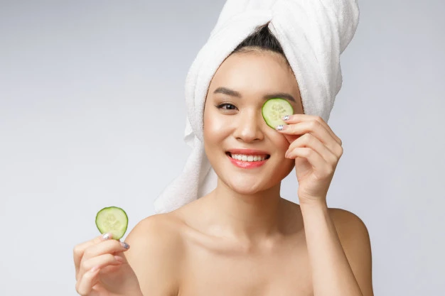 Smiling woman using cucumber extract on face - Cucumber Extract in Skincare: Top Benefits & Uses 2026 - Zicail Smiling woman using cucumber extract on face - Cucumber Extract in Skincare: Top Benefits & Uses 2026 - Zicail