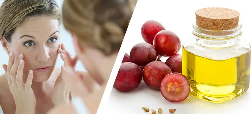 Woman applying grapeseed oil beside fresh grapes - Grapeseed Oil for Skin: Benefits & How to Use 2026 - Zicail