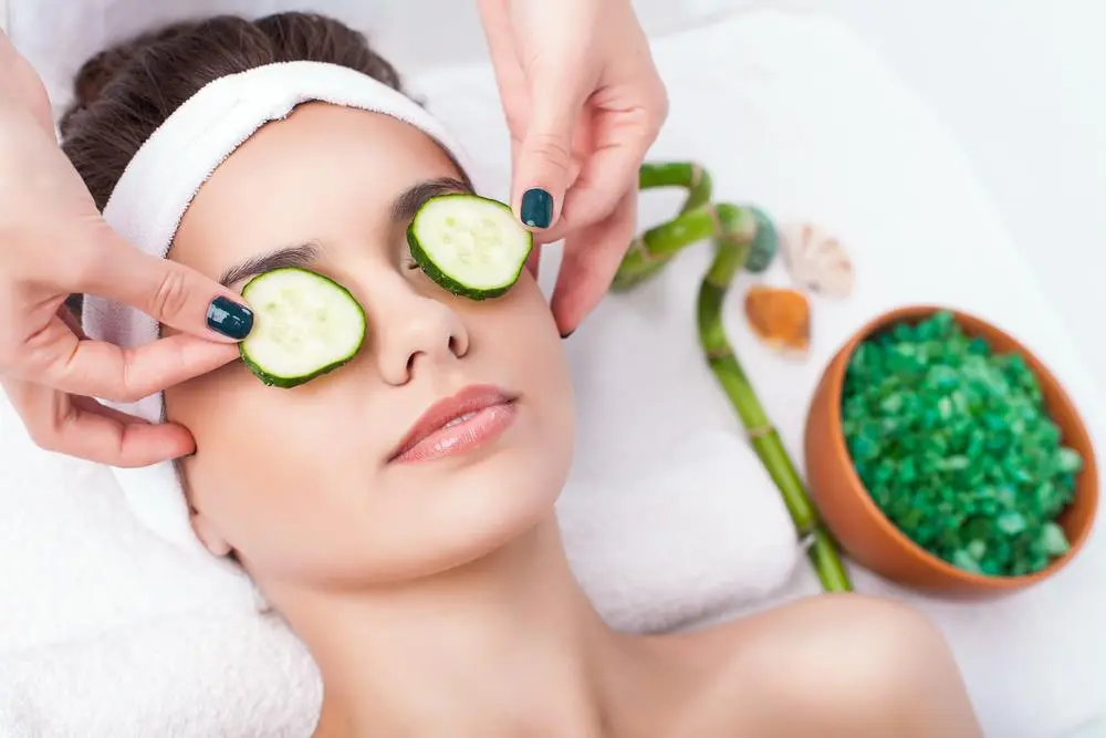 Woman relaxing with cucumber extract on eyes - Cucumber Extract in Skincare: Top Benefits & Uses 2026 - Zicail Woman relaxing with cucumber extract on eyes - Cucumber Extract in Skincare: Top Benefits & Uses 2026 - Zicail