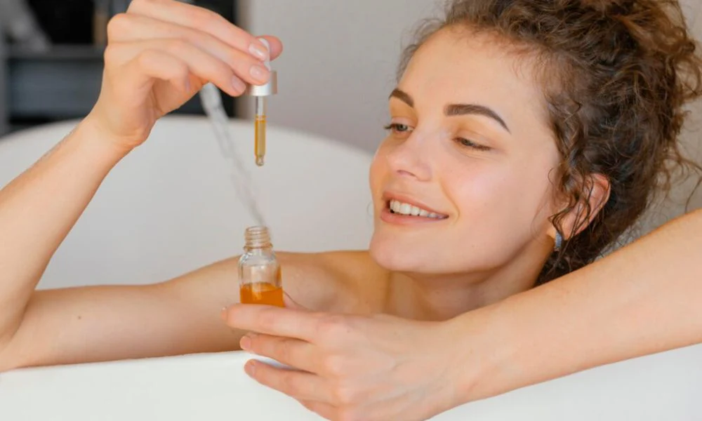 Woman using rosemary oil dropper for skincare treatment - Rosemary Oil for Skin: Benefits & Safe Use Guide 2026 - Zicail Woman using rosemary oil dropper for skincare treatment - Rosemary Oil for Skin: Benefits & Safe Use Guide 2026 - Zicail