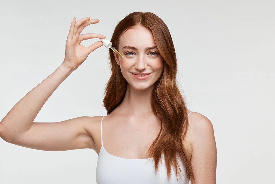 Woman using serum with Acetyl Glucosamine for skin glow - Acetyl Glucosamine for Skin: Benefits & Uses 2026 - Zicail